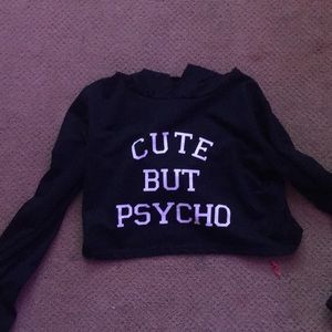 Cropped sweatshirt with words “cute but psycho” .